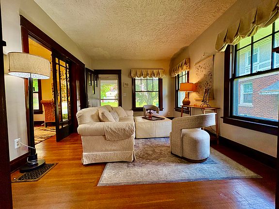 The view from the dining room shows the front door and French doors.