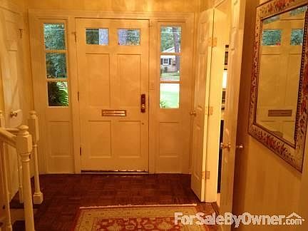 Foyer
						:
						Crystal light fixture
Coat closet
French doors to kitchen
Split stairs