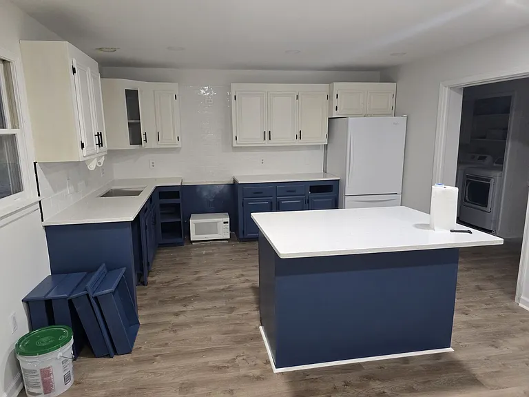 Kitchen renovation in progress; will feature new stainless steel dishwasher, stove, and microwave. Freshly painted cabinets, new backsplash, and granite counter tops.