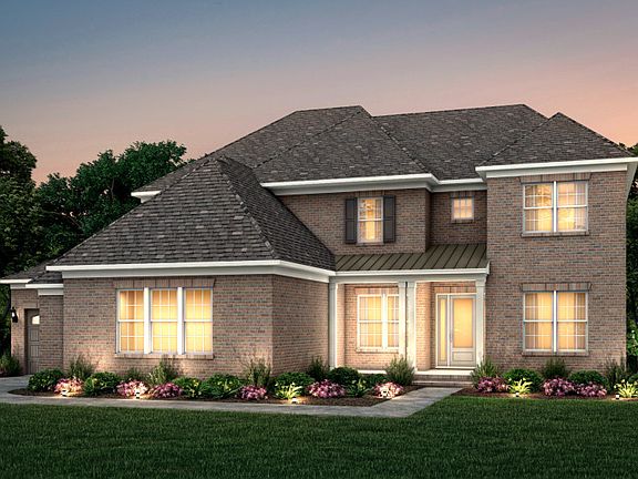 Hampton Exterior 10 features brick, covered front porch and 3 car sideload garage