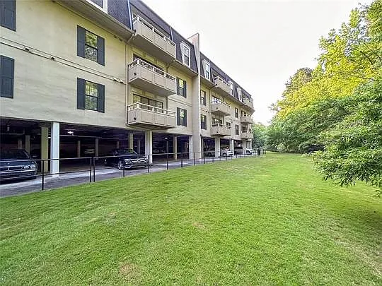 Parking garage/Pet walking area behind building.