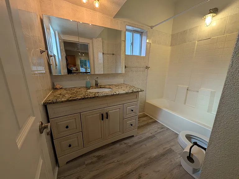 HIGH END VANITY HAS LARGE DRAWERS FOR ALL YOUR BATHROOM STORAGE NEEDS. MIRROR OPENS FOR MORE STORAGE BEHING GLASS