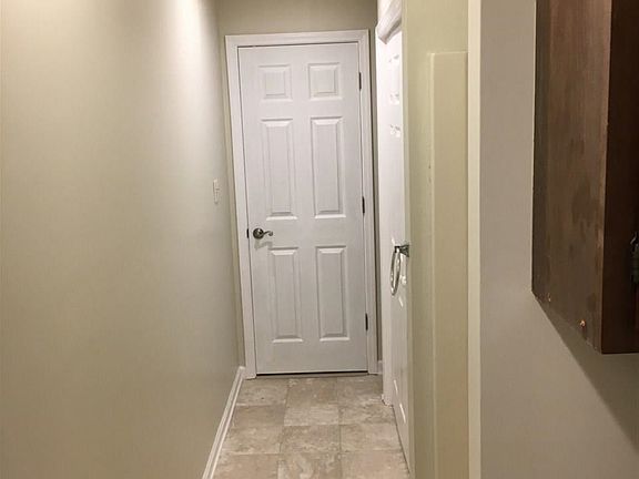 Hallway leading to laundry and 2nd bath