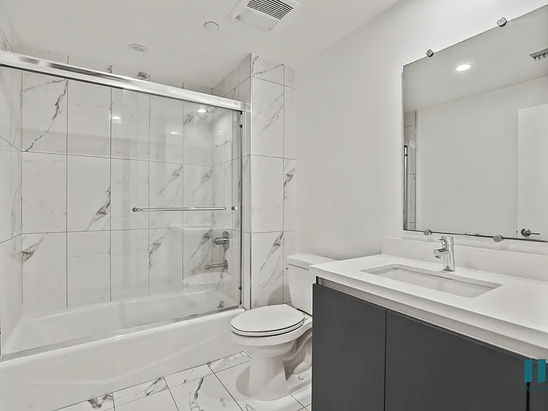 Bathroom with Shower Bath with Glass Doors and Vaniity Cabinet Storage