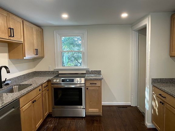 Be the first to enjoy this kitchen with brand new stove, dishwasher, garbage disposal and refrigerator ( not shown).