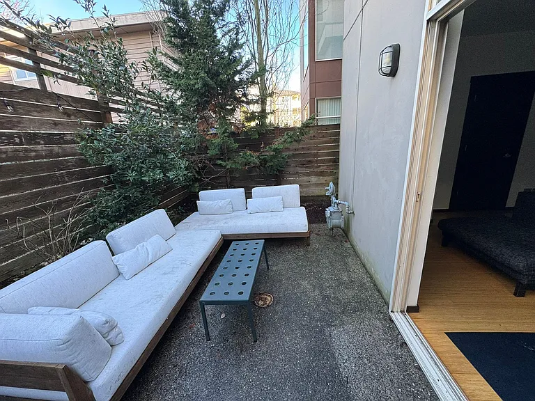 Outdoor space to fit outdoor table and/or sofas.