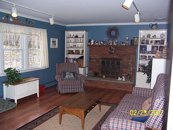 Comfortable Family Room with Wood Burning Fireplace
