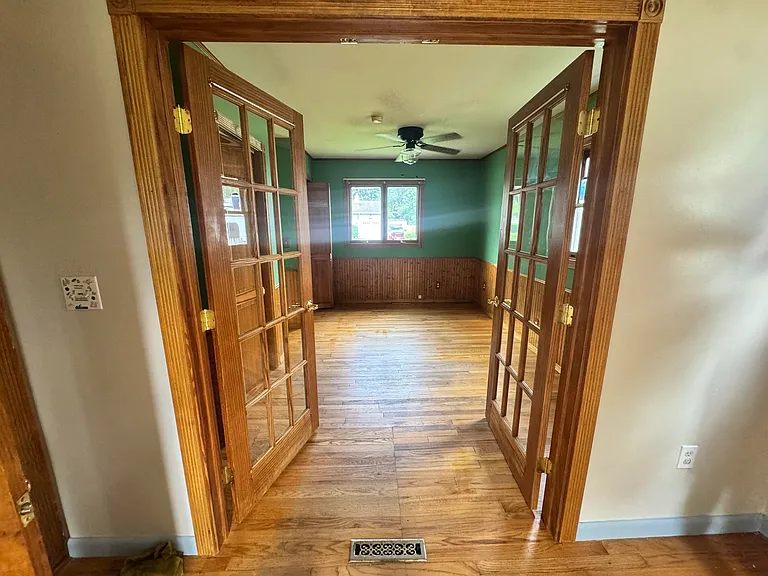 Master bedroom on first floor with attached office/bonus room