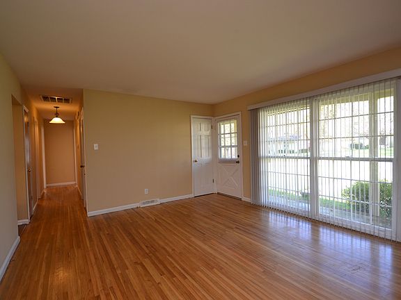 Living room has lots of light and beautiful wood floors