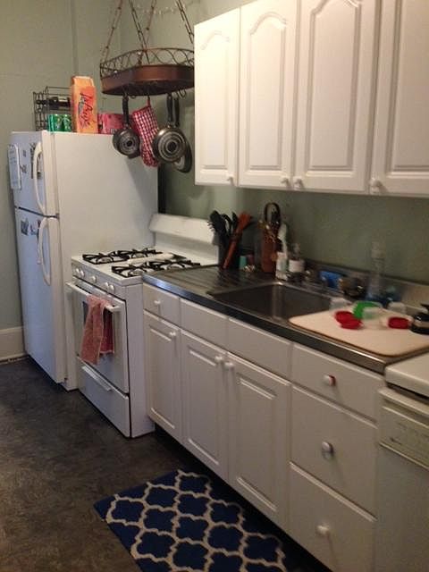 Great kitchen with ss counter and pot rack