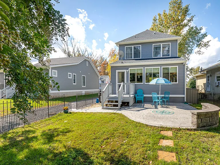 Backyard features awesome entertaining patio as well as pretty garden. Fenced in for your convenience.