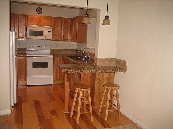 2nd Full kitchen in daylight basement w/eating bar.