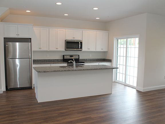 Open kitchen with spacious island and back patio