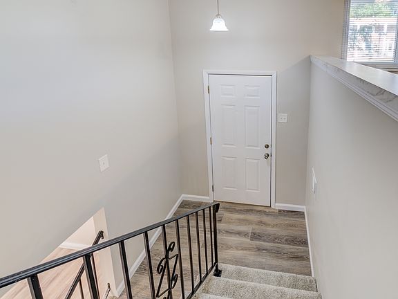 Split-level home featuring new flooring, new railings, and freshly painted walls and baseboards. Fully rehabbed home as you will see in the next pictures.