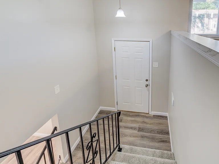 Split-level home featuring new flooring, new railings, and freshly painted walls and baseboards. Fully rehabbed home as you will see in the next pictures.