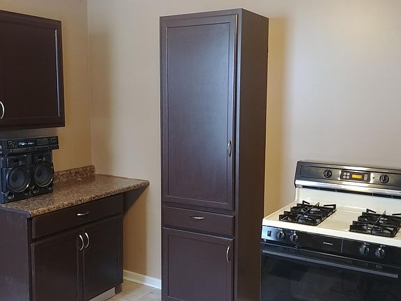 New extra storage cabinets and countertop gas stove