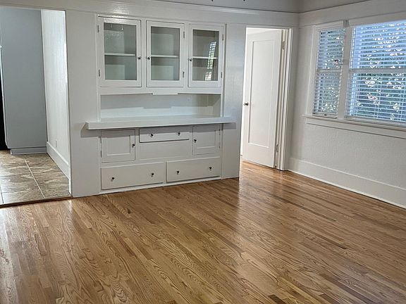 Beautiful Hardwood Floors throughout. The living area has the original built-in china cabinet.