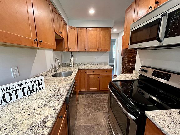 Renovated kitchen with cherry cabinets, granite counter tops and stainless steel appliances