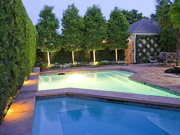 Pool area illuminated in the evening