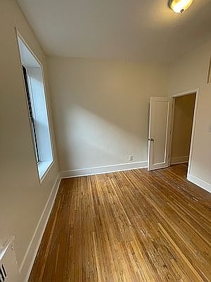 1st image of 302 E 3rd St APT 2c