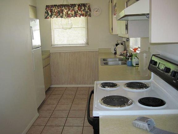 kitchen with ample cabinet space and pantry closet