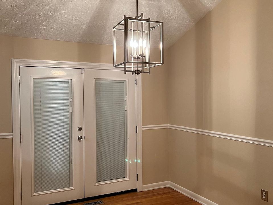 Dining room with vaulted ceiling and skylight