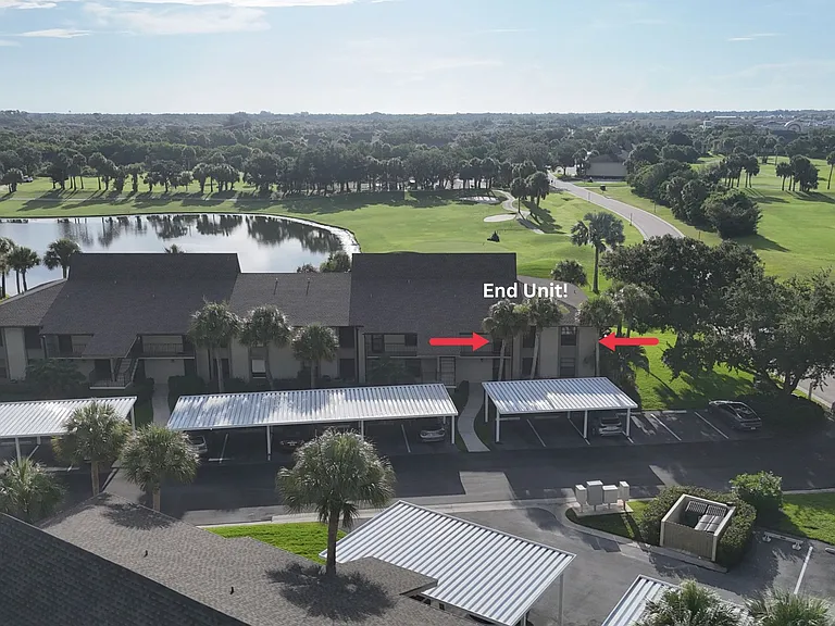 END UNIT w/ spectacular lake & golf course views!