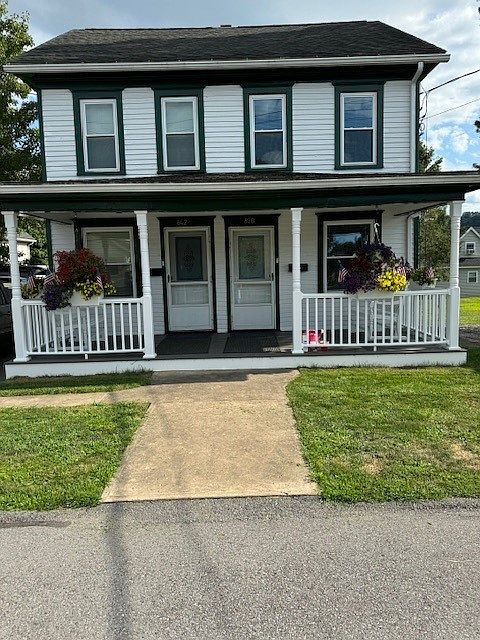 Unit available is on the right. Charming two story duplex house.