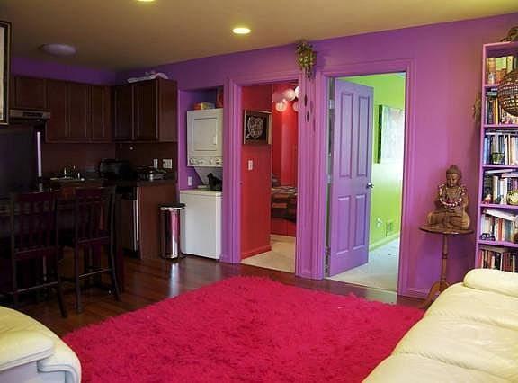 Enjoy leather furniture and Asian decor in the colorful, mod