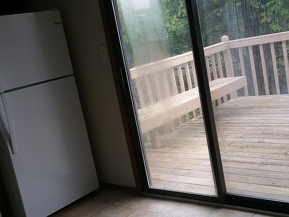 Dining area, in kitchen, looks at back deck.