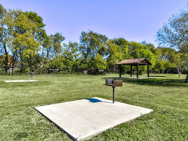 Community picnic and BBQ area for family cookouts and gatherings under the open sky.