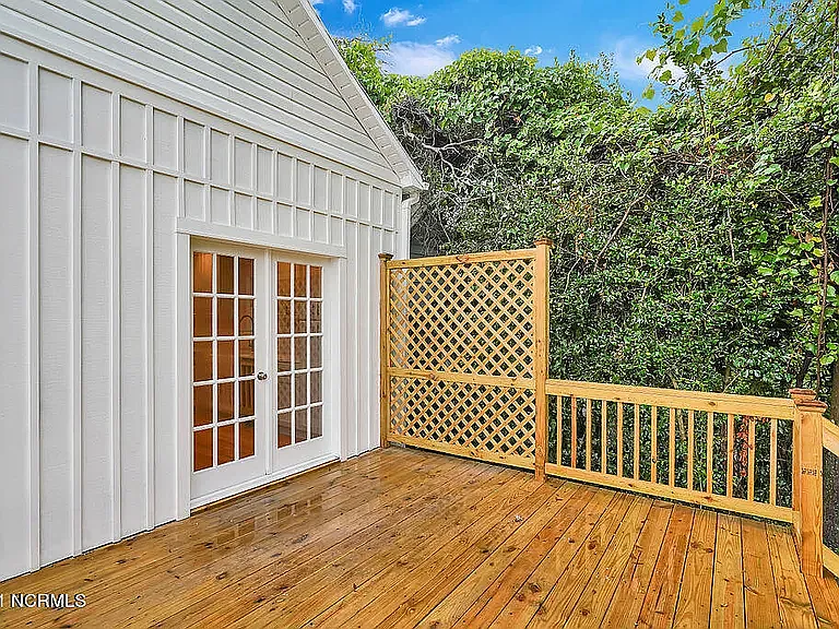 *original listing photo from when we purchased the home (back deck privacy screen)