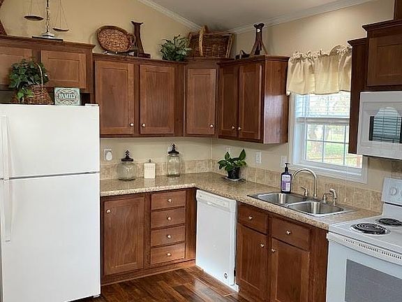 Kitchen has a great window over the sink. Fridge stays. Lots of cabinets and counter space.