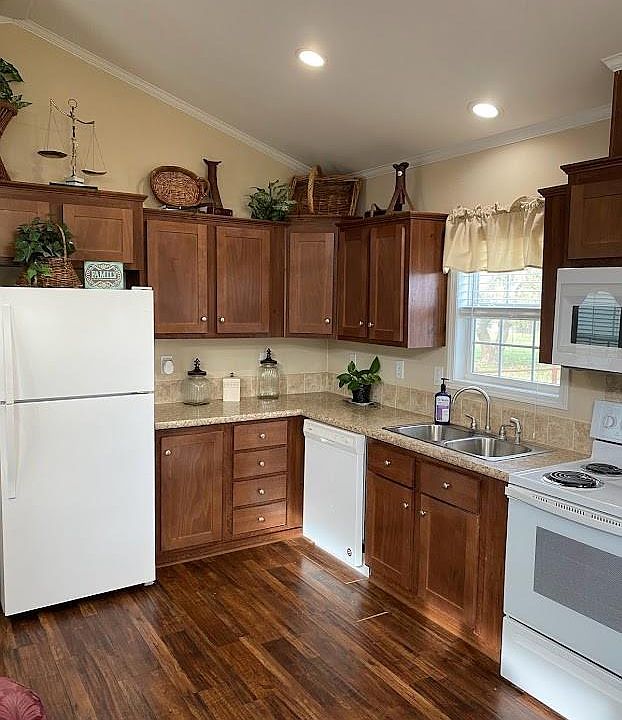 Kitchen has a great window over the sink. Fridge stays. Lots of cabinets and counter space.