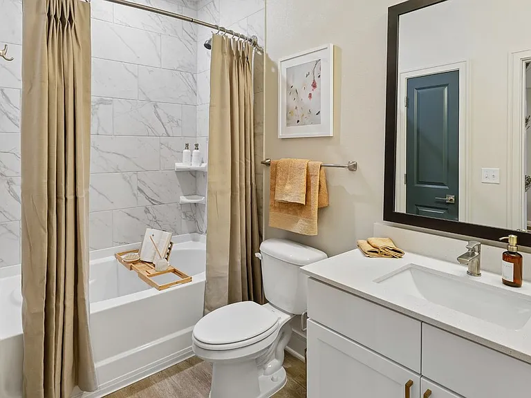 Bathroom with Quartz Countertop and Soaking Tub