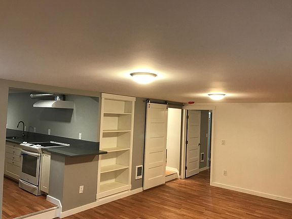 View of the apartment from entrance. Living area, kitchen, bath and bedroom is behind door at far right