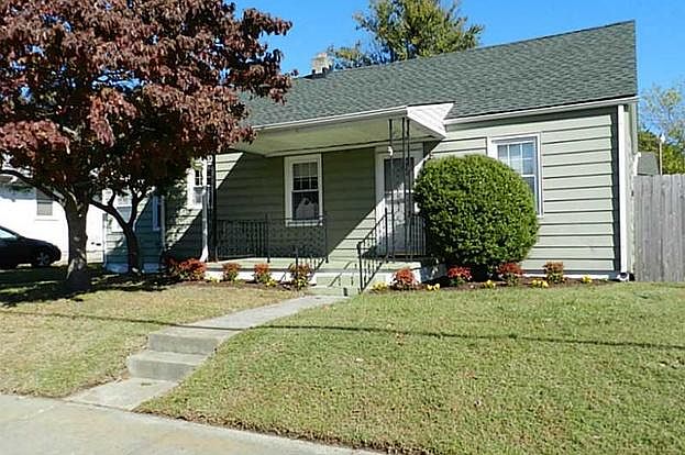 Front of home, driveway on the left side of the trees, on-street parking is available