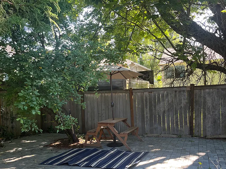 Shaded picnic area on paver patio
