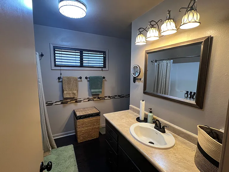 Main floor bathroom, attached to both living area and Master Bedroom