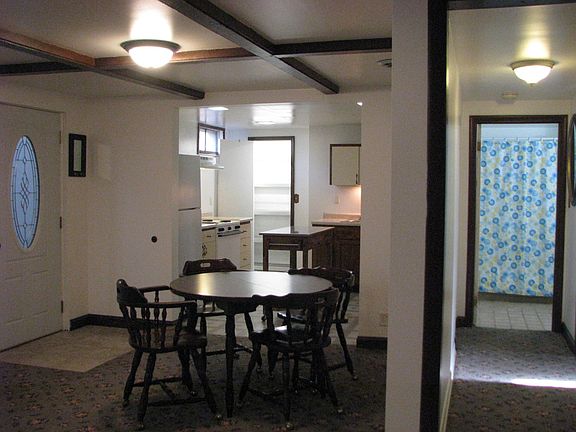 Main Entry Door, Dining Area, Kitchen Entrance showing Pantry Doorway, Hallway to Bathroom and Storage/Laundry Area.