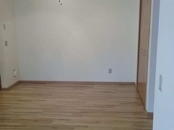 Wood floors are in hall and dining area