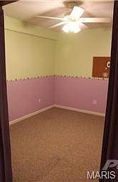 Basement room with french doors that could be used for office
