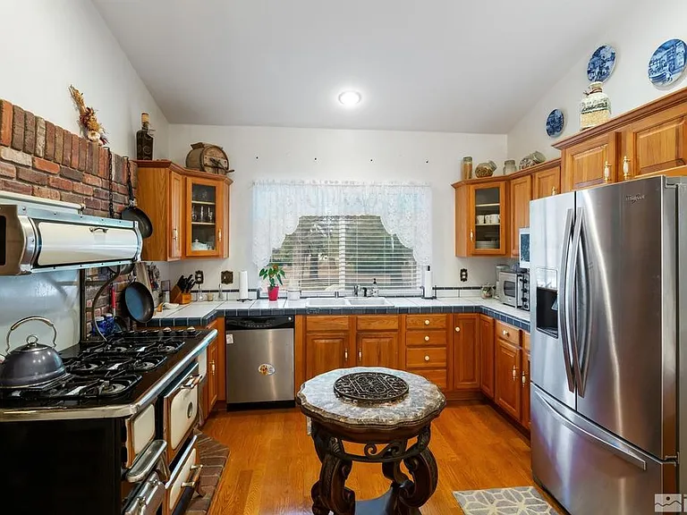 Country kitchen, common area. You have 1/2 of the large fridge and your own area in the pantry. New Dishwasher, countertop oven/air fryer, KitchenAid mixer, espresso, machine, blender, nut milk maker.