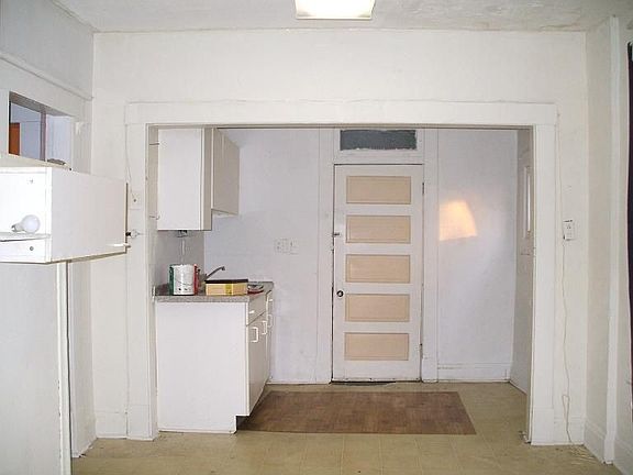 Kitchen with door to one of the enclosed porches
