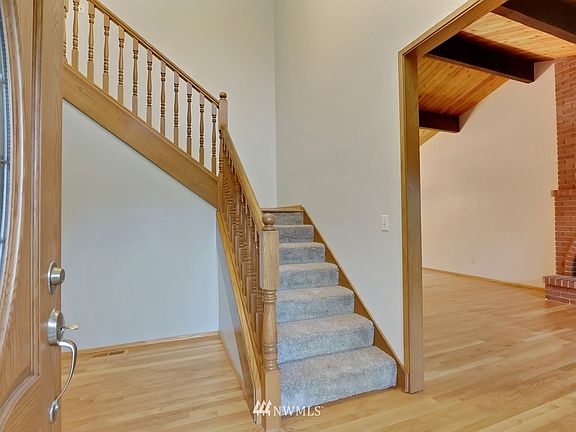 The entry opens to expansive hardwood flooring!
