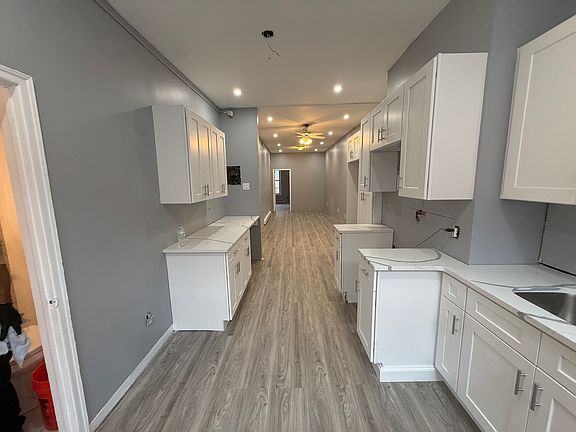 side pantry with counter over hang for stools