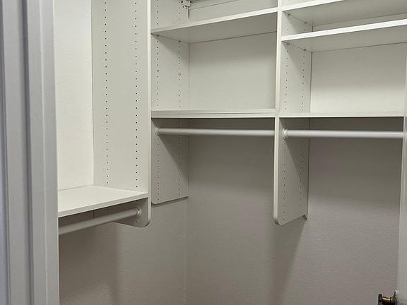 walk-in closet in one of the bedrooms