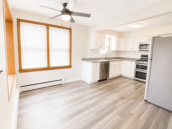 stunning new kitchen with upgraded stainless steel appliances,