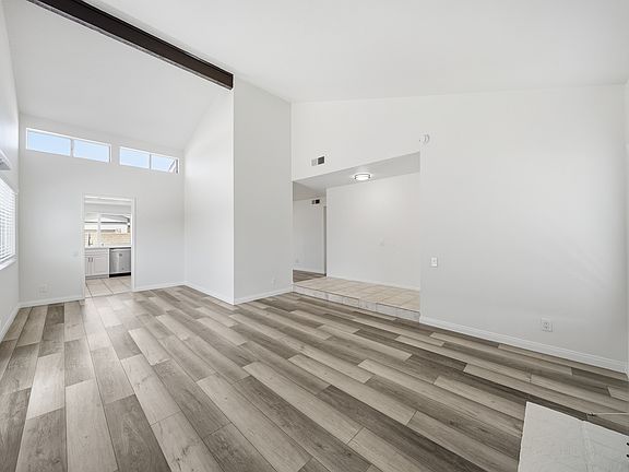 Large open living room with vaulted ceiling.