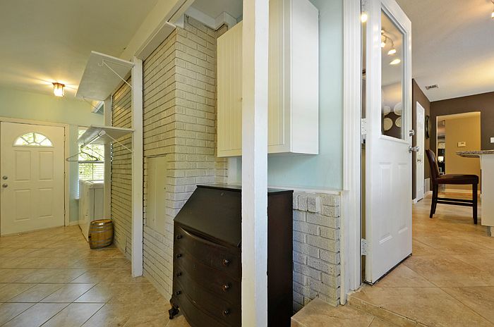 Utility room w/brick accent.
